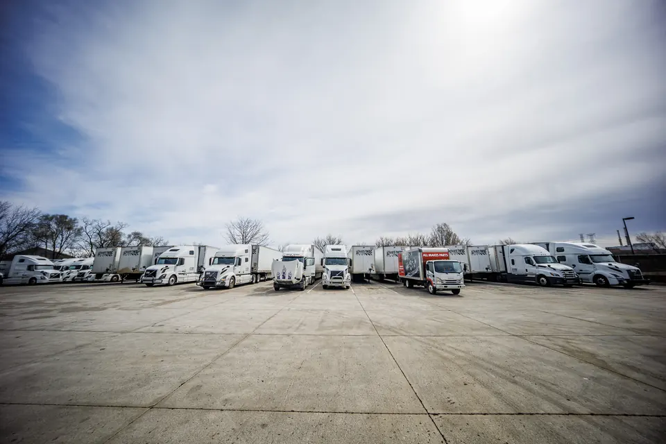 Truck Clinic shop exterior at 565 Anderson Dr in Romeoville, IL, with semi trucks parked along the building