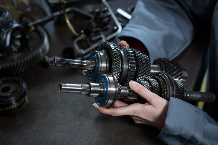 person holding truck repair parts