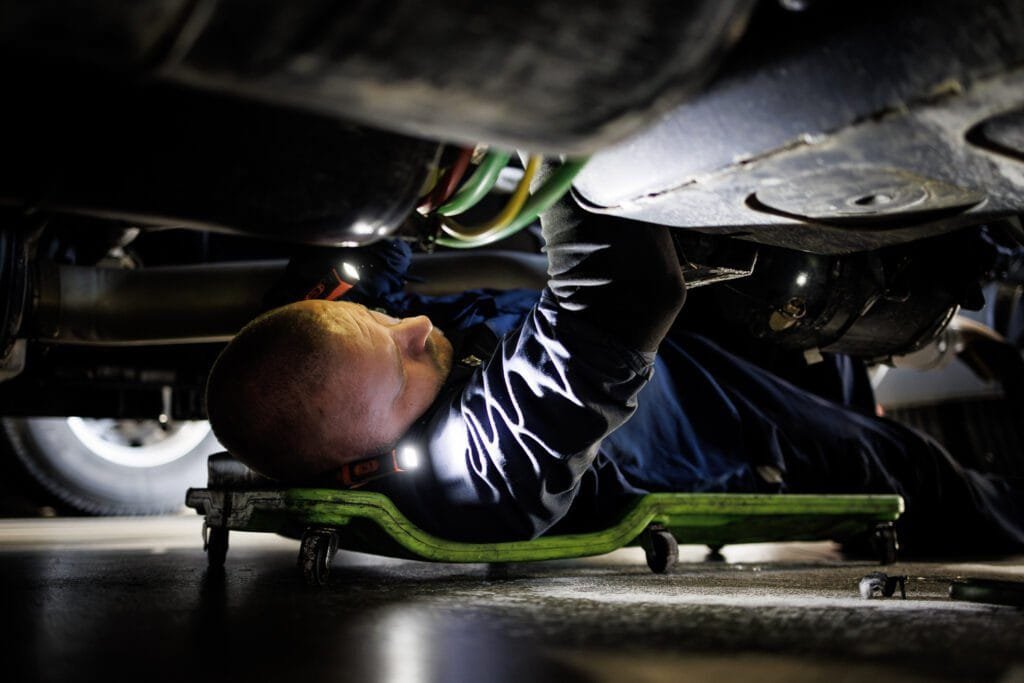 truck repair service worker under the truck