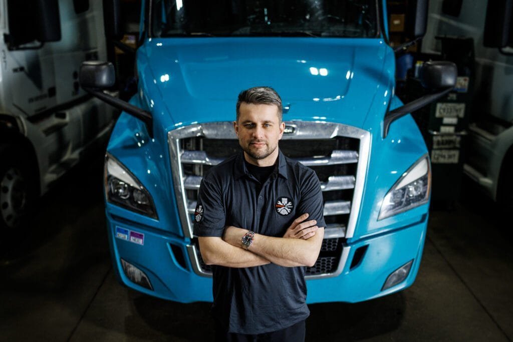 Truck Rpeair specialist near a blue truck
