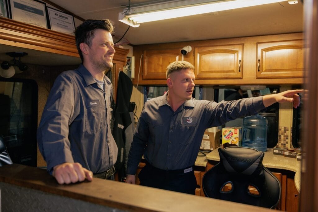 two repair man smiling